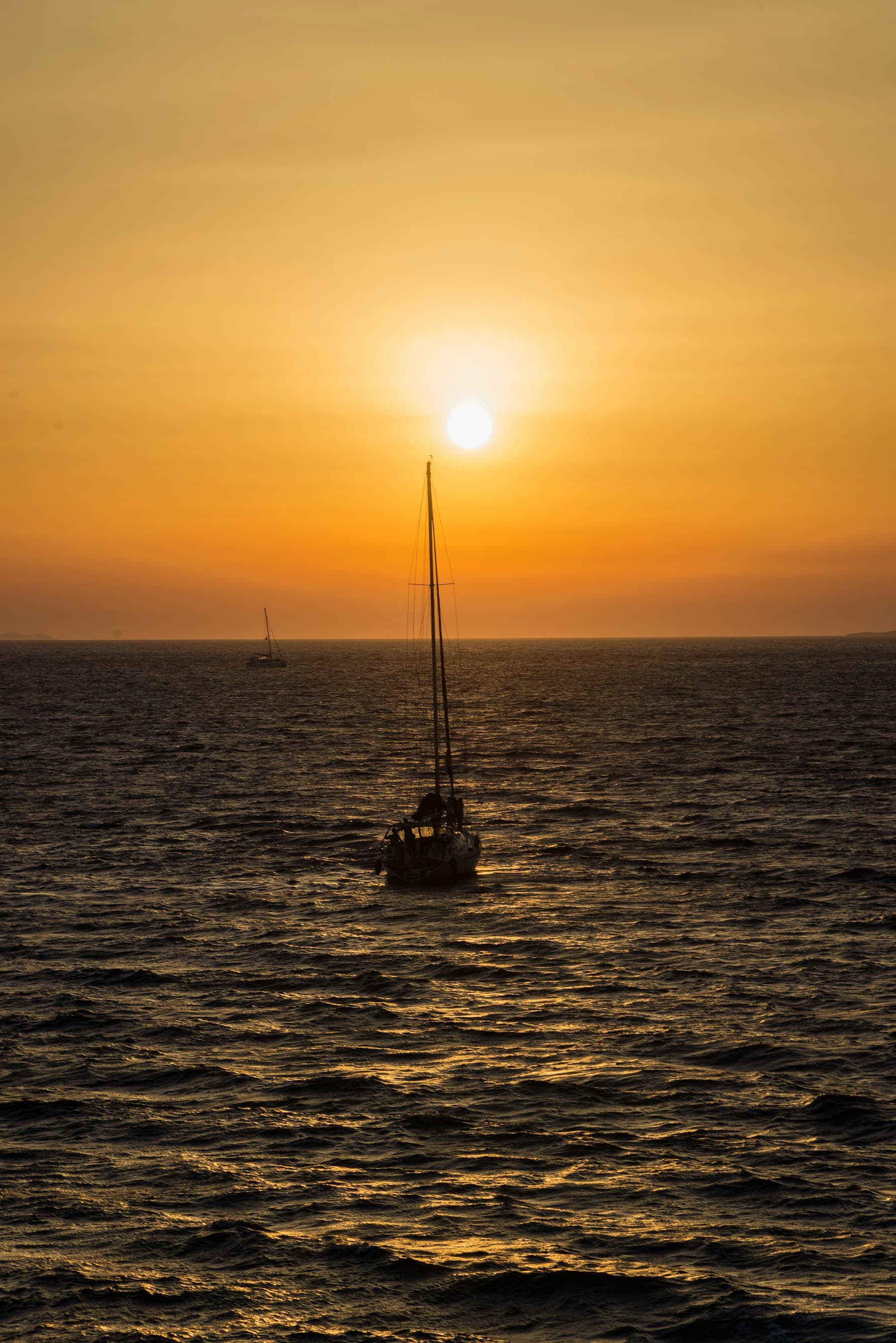Sailboat at sunset off the California coast