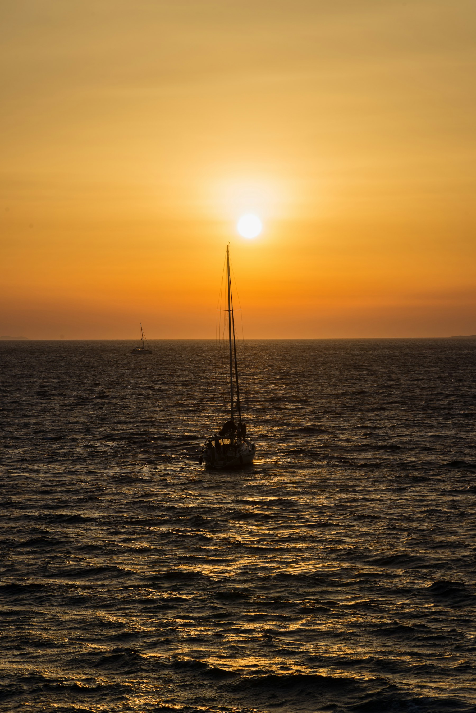 Sailboat at sunset off the California coast